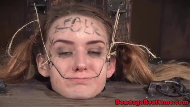Femdom rubs pussyjuice on suspended teen